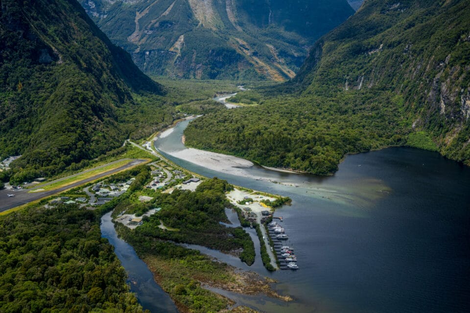 Milford Sound Airport on the left and the Milford Road comes down the valley centre photo